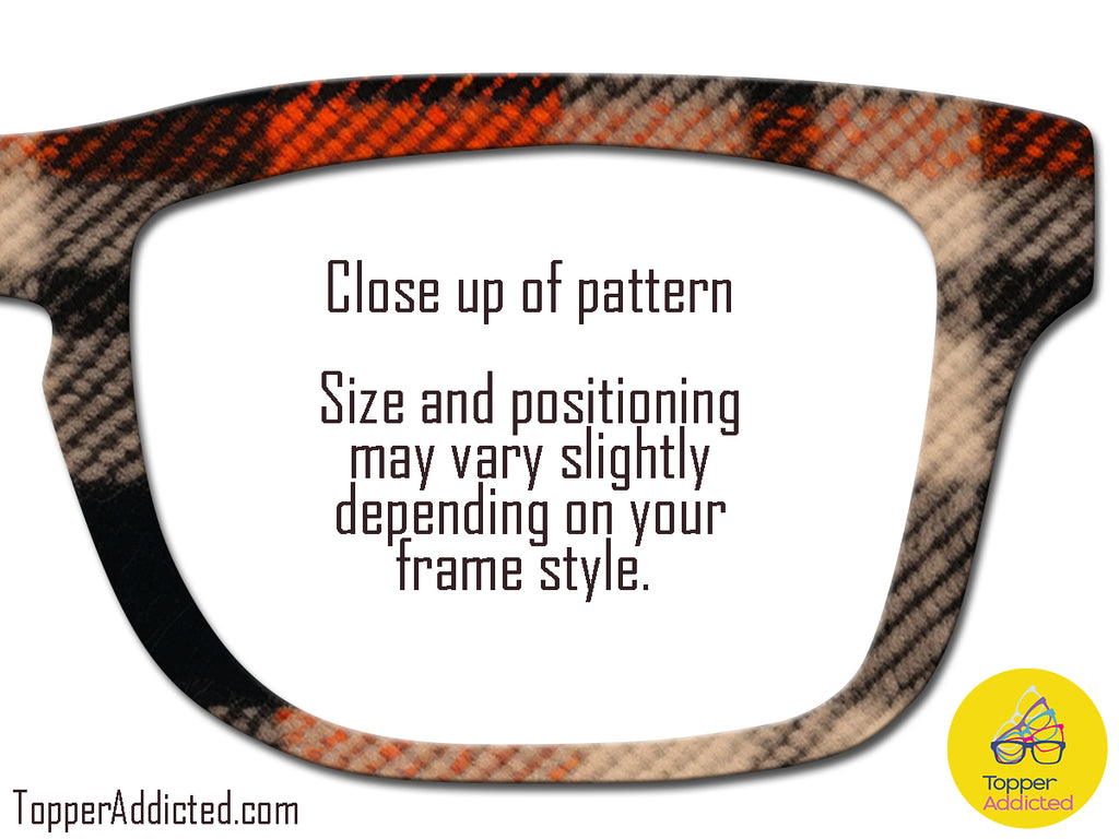 Close-up of a patterned eyeglass frame with text and a brand logo.