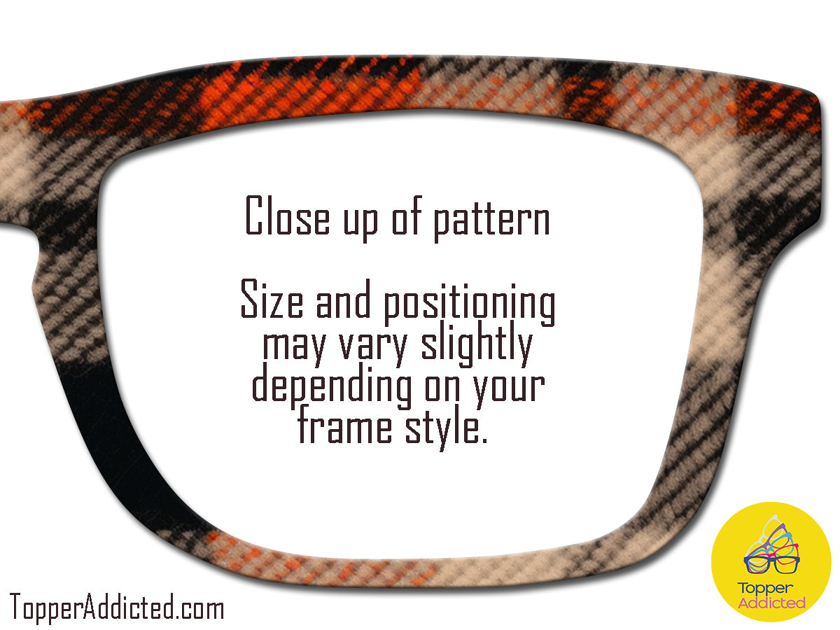 Close-up of a patterned eyeglass frame with text and a brand logo.