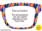 Close-up of a colorful feather print on eyeglass frame pattern with text indicating size and positioning may vary.